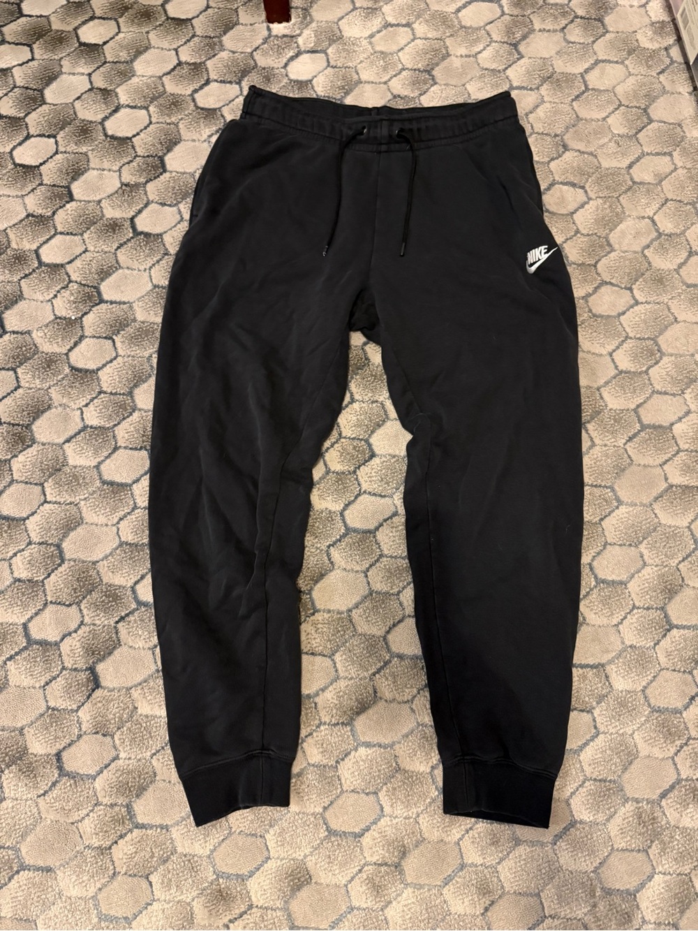 Nike Black Sweatpants with White Swoosh Tag.